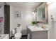 Bathroom features a modern vanity, framed mirror, stylish lighting, and neutral paint at 2221 N Richland St, Phoenix, AZ 85006