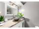 Bathroom featuring a vessel sink, designer mirror, and granite countertop at 2221 N Richland St, Phoenix, AZ 85006