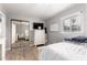 Bedroom with natural light, featuring wood-look flooring, and mirrored closet at 2221 N Richland St, Phoenix, AZ 85006