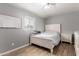 Bedroom featuring a window with blinds, LVP flooring, and a whiteboard at 2221 N Richland St, Phoenix, AZ 85006