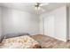 Well-lit bedroom offering a ceiling fan, tile floors, and closet at 2221 N Richland St, Phoenix, AZ 85006