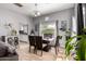 Bright dining area with a modern table, chandelier, and lots of natural light at 2221 N Richland St, Phoenix, AZ 85006