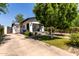 Home featuring a front porch, a basketball hoop in the driveway, and desert landscaping at 2221 N Richland St, Phoenix, AZ 85006