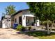 Cozy home with a front porch, desert landscaping, and a basketball hoop in the driveway at 2221 N Richland St, Phoenix, AZ 85006