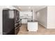Bright kitchen featuring white cabinets, a central island, and stainless-steel appliances at 2221 N Richland St, Phoenix, AZ 85006