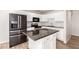 Updated kitchen featuring white cabinets, granite countertops, and stainless-steel appliances at 2221 N Richland St, Phoenix, AZ 85006