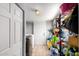 Well-lit laundry room providing ample storage with shelving and closet space at 2221 N Richland St, Phoenix, AZ 85006