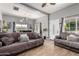 Open-concept living room with tile floors and neutral-colored sofas and decor at 2221 N Richland St, Phoenix, AZ 85006