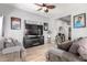 Cozy living room featuring neutral tones, wood flooring, and a large entertainment center at 2221 N Richland St, Phoenix, AZ 85006