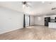 Open living room features wood-look tile, white walls, recessed lighting, and french doors at 2221 N Richland St, Phoenix, AZ 85006