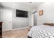 Main bedroom featuring a vaulted ceiling, tv, and luxury vinyl plank flooring at 2221 N Richland St, Phoenix, AZ 85006
