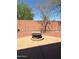 An outdoor fire pit is the focal point of this backyard, perfect for outdoor entertaining and socializing at 23890 W Twilight Trl, Buckeye, AZ 85326