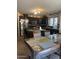 Spacious kitchen with granite counters, stainless appliances and a breakfast bar at 23890 W Twilight Trl, Buckeye, AZ 85326