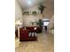 Inviting living room with high ceilings, tile floors, and ample natural light at 23890 W Twilight Trl, Buckeye, AZ 85326