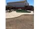 Enjoy this pool with rock waterfall feature and desert landscaping for a backyard oasis at 23890 W Twilight Trl, Buckeye, AZ 85326