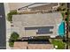 Aerial view of a house with solar panels, a pool, and manicured landscaping at 26943 N 74Th Ave, Peoria, AZ 85383