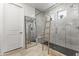 Bathroom with a modern frameless glass shower and a rustic wooden towel ladder next to the shower at 26943 N 74Th Ave, Peoria, AZ 85383