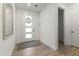 Bright entryway with modern door, wood-look tile flooring, and clean, neutral decor at 26943 N 74Th Ave, Peoria, AZ 85383