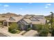 Attractive single-story home featuring a stone facade, desert landscaping, and a two-car garage at 26943 N 74Th Ave, Peoria, AZ 85383