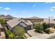 Exterior shot of a single-Gathering home with desert landscaping and a two-car garage at 26943 N 74Th Ave, Peoria, AZ 85383