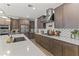 Modern kitchen with stainless steel appliances and quartz countertop island with sink at 26943 N 74Th Ave, Peoria, AZ 85383