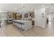 Modern kitchen with stainless steel appliances and large quartz countertop island at 26943 N 74Th Ave, Peoria, AZ 85383