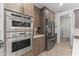 Close up on kitchen appliances, stainless steel fridge and microwave oven combo at 26943 N 74Th Ave, Peoria, AZ 85383