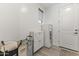 Well-organized laundry area with white cabinetry and storage options at 26943 N 74Th Ave, Peoria, AZ 85383