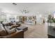 Open-concept living space featuring a kitchen, living room, and dining area perfect for modern living at 26943 N 74Th Ave, Peoria, AZ 85383