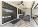 Covered patio with comfortable seating, ceiling fans, and a view of the backyard pool at 26943 N 74Th Ave, Peoria, AZ 85383