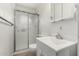 Bathroom featuring tile floors, vanity, and a shower with sliding glass doors at 3208 W Port Royale Ln, Phoenix, AZ 85053