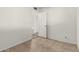 Bedroom featuring tile floors and a closet at 3208 W Port Royale Ln, Phoenix, AZ 85053