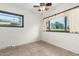 Bedroom featuring tile flooring, natural light and a ceiling fan at 3208 W Port Royale Ln, Phoenix, AZ 85053