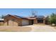 Charming single-story home with solar panels and a two-car garage at 3208 W Port Royale Ln, Phoenix, AZ 85053