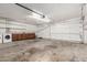 Spacious garage with laundry area, cabinets, and ample storage space at 3208 W Port Royale Ln, Phoenix, AZ 85053