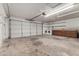 Large garage space with laundry area and cabinets providing ample storage solutions at 3208 W Port Royale Ln, Phoenix, AZ 85053