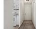 View of a white hallway leading to the front door at 3208 W Port Royale Ln, Phoenix, AZ 85053