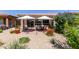 Backyard with patio seating and desert landscaping at 35990 N Desert Tea Dr, Queen Creek, AZ 85140