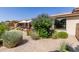 Landscaped backyard with patio and desert plants at 35990 N Desert Tea Dr, Queen Creek, AZ 85140