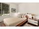 Comfortable bedroom features a platform bed, accent lighting and a view to the outdoors at 35990 N Desert Tea Dr, Queen Creek, AZ 85140