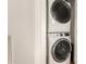 Efficient laundry area with stacked washer and dryer at 35990 N Desert Tea Dr, Queen Creek, AZ 85140