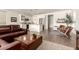 Open-concept living area showcasing modern furniture and seamless flow to the kitchen at 35990 N Desert Tea Dr, Queen Creek, AZ 85140