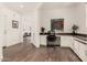 Spacious home office area featuring built-in desk with plenty of storage space at 35990 N Desert Tea Dr, Queen Creek, AZ 85140