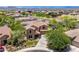 Aerial view showcases a lovely home with mature landscaping, a pool, and proximity to neighborhood amenities at 3760 W Lapenna Dr, New River, AZ 85087