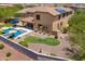 Wonderful backyard with a sparkling pool, spa, hammock, covered patio, and luscious landscaping at 3760 W Lapenna Dr, New River, AZ 85087