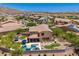 Wonderful backyard with a sparkling pool, spa, hammock, covered patio, and luscious landscaping at 3760 W Lapenna Dr, New River, AZ 85087