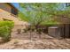 Cozy backyard with desert landscaping, privacy fence and mature tree, perfect for outdoor living at 3760 W Lapenna Dr, New River, AZ 85087