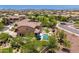Wonderful backyard with a sparkling pool, spa, hammock, covered patio, and luscious landscaping at 3760 W Lapenna Dr, New River, AZ 85087