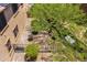Birds eye view of private backyard with mature desert tree, shrubs and desert rock landscaping at 3760 W Lapenna Dr, New River, AZ 85087