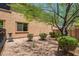 Private backyard featuring desert landscaping, stucco walls and mature tree providing shade and privacy at 3760 W Lapenna Dr, New River, AZ 85087